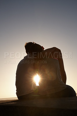 Buy stock photo Silhouette of a couple sitting beside each other outside