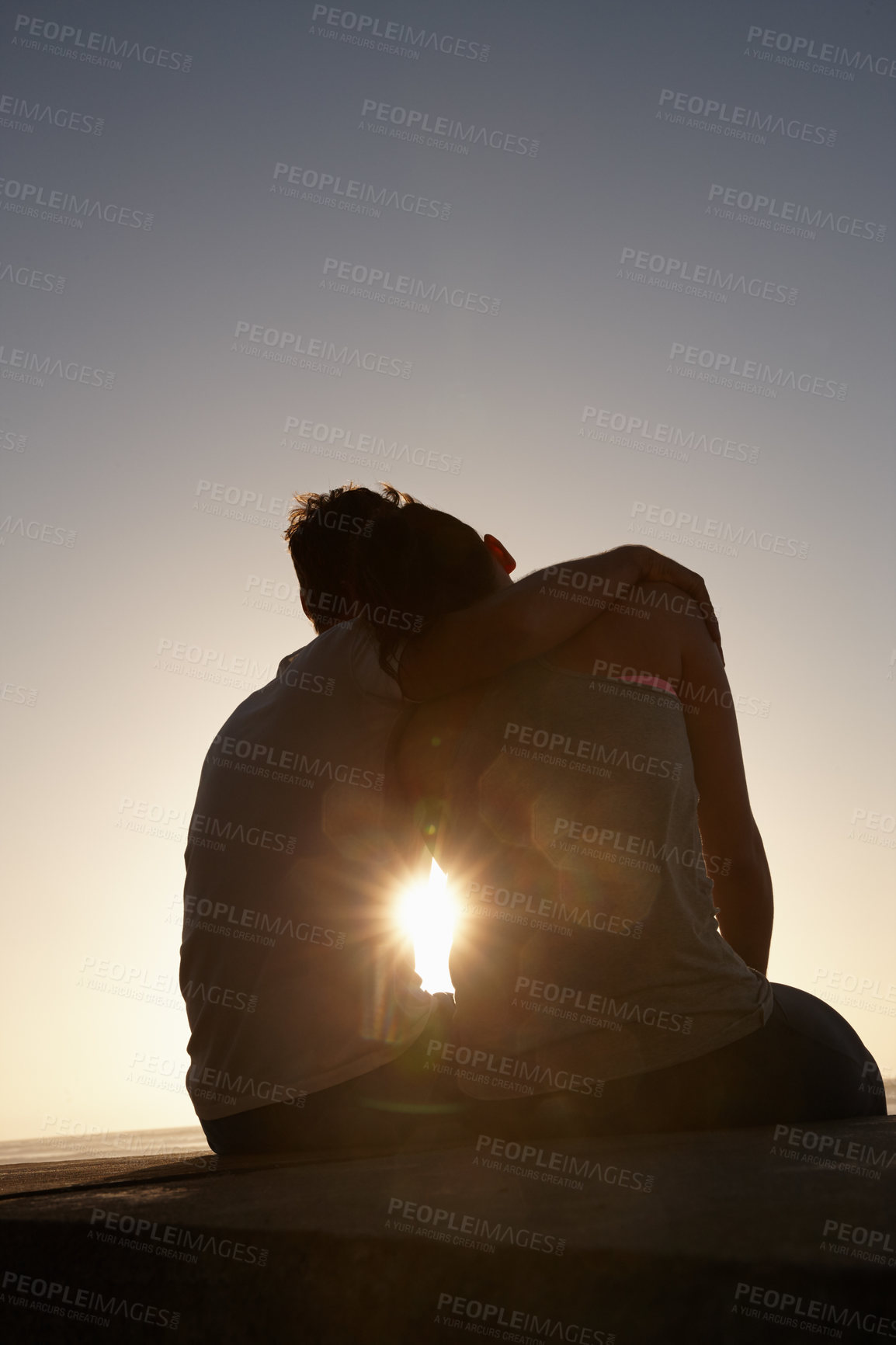 Buy stock photo Silhouette of a couple sitting beside each other outside