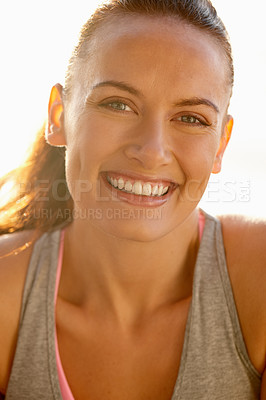 Buy stock photo Closeup portrait of an attractive woman standing outside on a sunny day