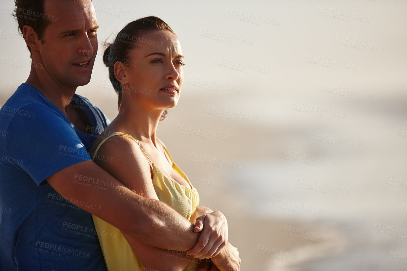 Buy stock photo Shot of an affectionate couple on the beach