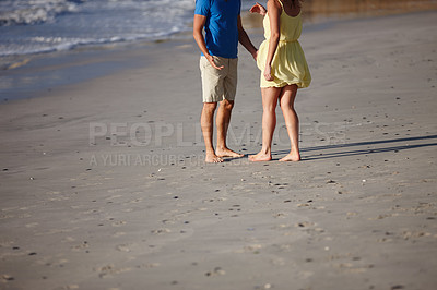 Buy stock photo Shot of an affectionate couple on the beach