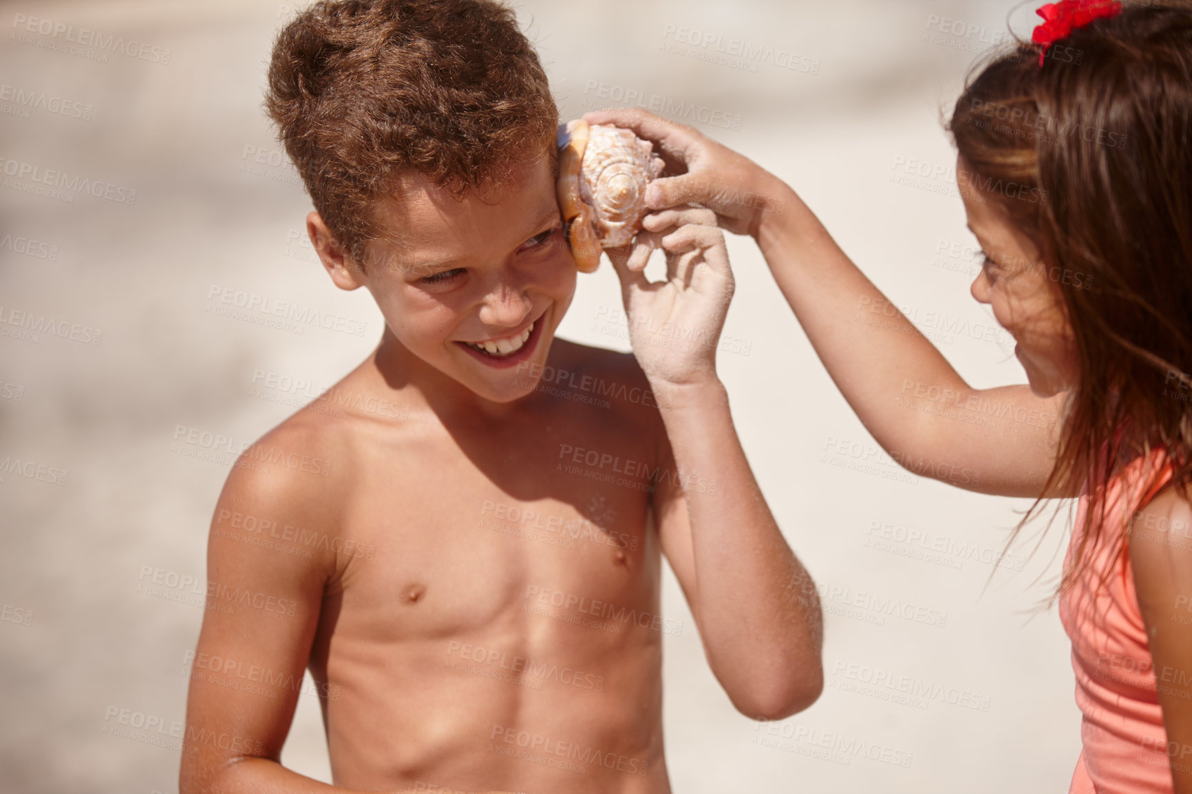 Buy stock photo Curious, kids and listening to shell on beach for creative imagination, travel adventure or bonding. Family, children and happy with seashell for ocean sound, sensory stimulation and summer vacation
