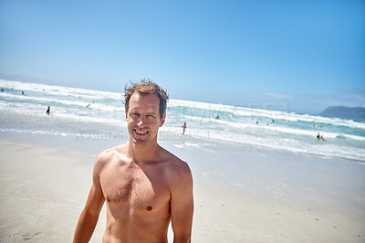 Buy stock photo Portrait of a handsome man standing on the beach