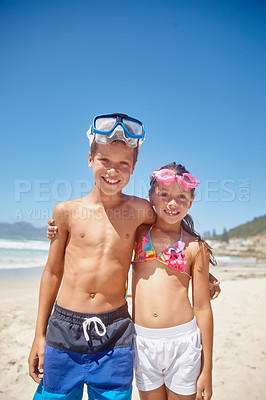 Buy stock photo Portrait of a brother and sister standing together on the beach