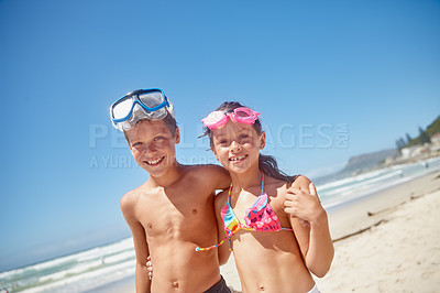 Buy stock photo Portrait of a brother and sister standing together on the beach