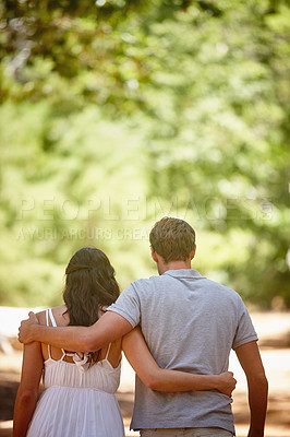 Buy stock photo Shot of a happy couple enjoying a carefree day together in the forest