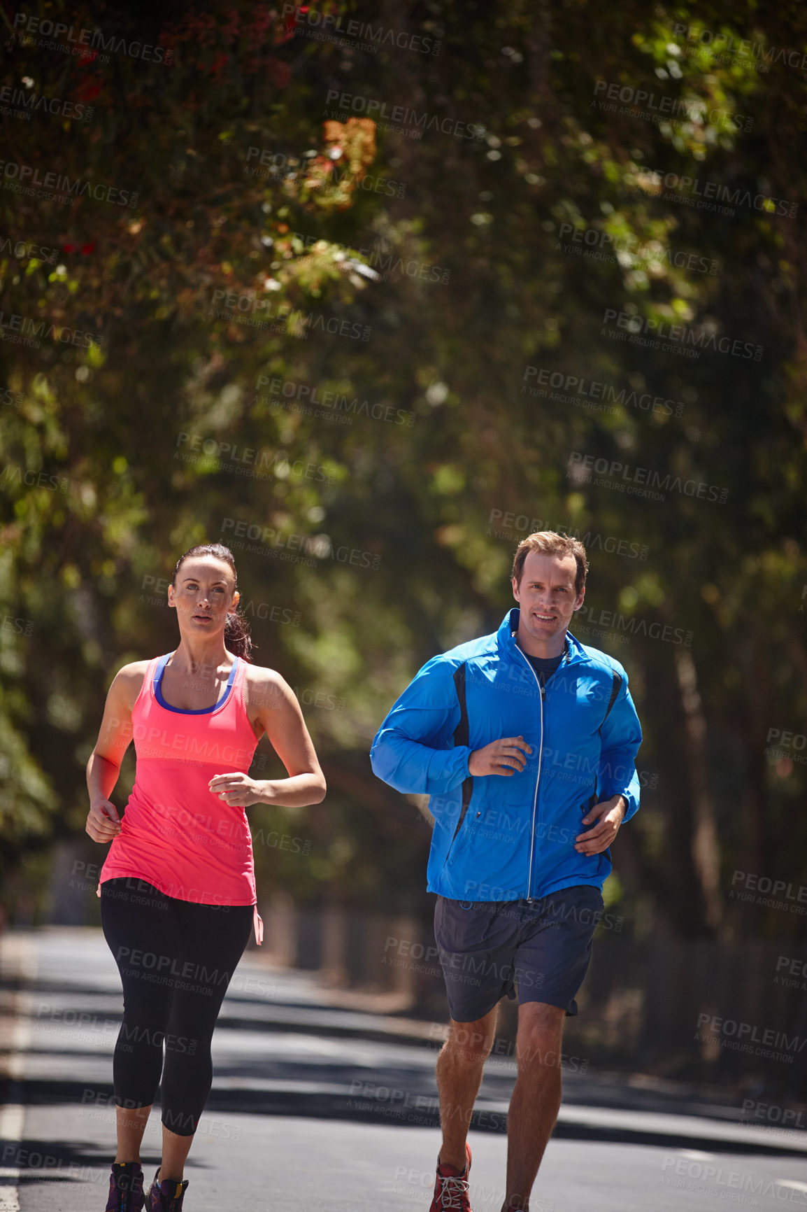 Buy stock photo Running, exercise and couple in street, training and cardio with endurance, challenge and support. Outdoor, runners and man with woman, relationship and bonding together with fitness and wellness