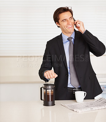 Buy stock photo Happy businessman, phone call and coffee for discussion or communication in kitchen at home. Man or employee smile and talking on mobile smartphone for morning conversation or caffeine drink at house
