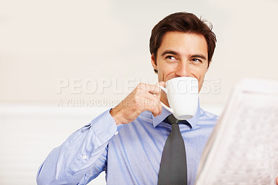 Buy stock photo Thinking, coffee and newspaper with a business man in his home in the morning to start his work day. Relax, idea and happy young corporate employee drinking tea from a cup on a sofa in his apartment