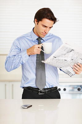 Buy stock photo Business man, reading newspaper and coffee cup in kitchen for thinking, idea or check stats on global market. Trader, investor and morning paper for announcement, stock and decision for financial job