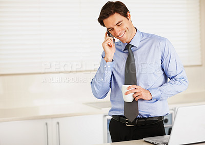 Buy stock photo Happy businessman, phone call and laptop with coffee for discussion or communication in kitchen at home. Man or employee talking on mobile smartphone for morning conversation with cup of tea at house
