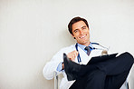 Relaxed doctor with a stethoscope and notepad