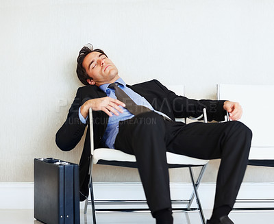 Buy stock photo Business man, sleeping and case in airport, chair or fatigue from travel, overworked or burnout in suit. Entrepreneur, briefcase and tired for rest, exhausted or luggage for corporate job with stress