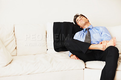 Buy stock photo Business man sleeping on sofa in home from burnout, overworked and fatigue in living room. Tired, exhausted and sleepy entrepreneur rest for nap, break and asleep on couch to relax from low energy