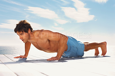 Buy stock photo Man, push up and strong with training for health body, fitness and exercise by sky background. Young model, confident and natural glow with wellness and muscle workout outdoor on summer vacation