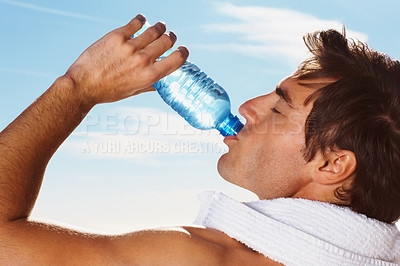 Buy stock photo Young man, drinking water bottle or towel for workout with health body, fitness and vacation. Model, thirsty or natural glow with h2o drink for hydration or post cardio exercise by sky background