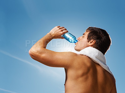 Buy stock photo Young man, drinking water and bottle for hydration with health body, fitness and happiness on vacation. Model, thirst and towel with natural glow for wellness and post exercise for relax in summer