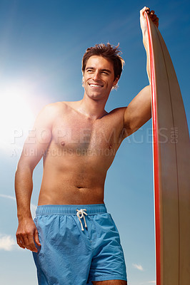 Buy stock photo Man, surfing and board with smile by sky, summer or ready for fitness, health or training. Athlete, surfer and sunshine on holiday, happy or thinking outdoor for ideas, workout or exercise in nature