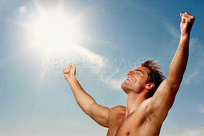 Buy stock photo Freedom, hands raised and a shirtless man on a blue sky with flare for fresh air in summer during vacation. Health, fitness and winner with the body of a confident young person outdoor for wellness