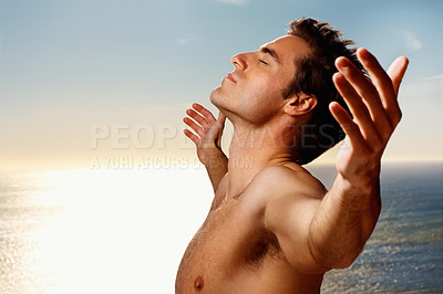 Buy stock photo Breathing, freedom and a shirtless man on a blue sky with flare for fresh air in summer during vacation. Health, wellness and arms raised with the body of a young person outdoor for awareness