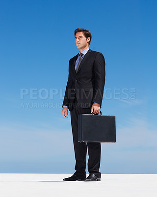 Buy stock photo Briefcase, sky and young businessman thinking on building rooftop in the city with serious expression. Idea, bag and professional male person from Canada standing and dreaming or planning for work.
