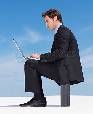 Buy stock photo Business man, laptop and typing an email, blue sky background and online research for proposal. Male person, professional and digital technology for networking, planning and internet connection
