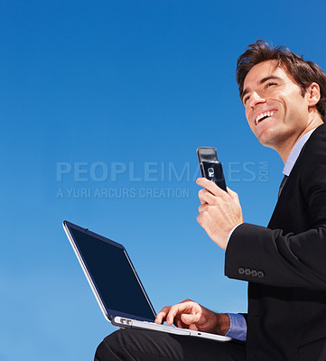 Buy stock photo Businessman, laptop and typing an email, phone and blue sky background or online research for proposal. Male person, professional and technology for networking, communication and internet connection