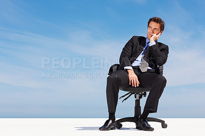 Buy stock photo Sky, space and a business man thinking on a chair for planning with vision for the future of his company. Corporate, idea and mockup with a young employee in a suit on a cloudy blue background