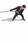Top view of young business man pulling a rope on white