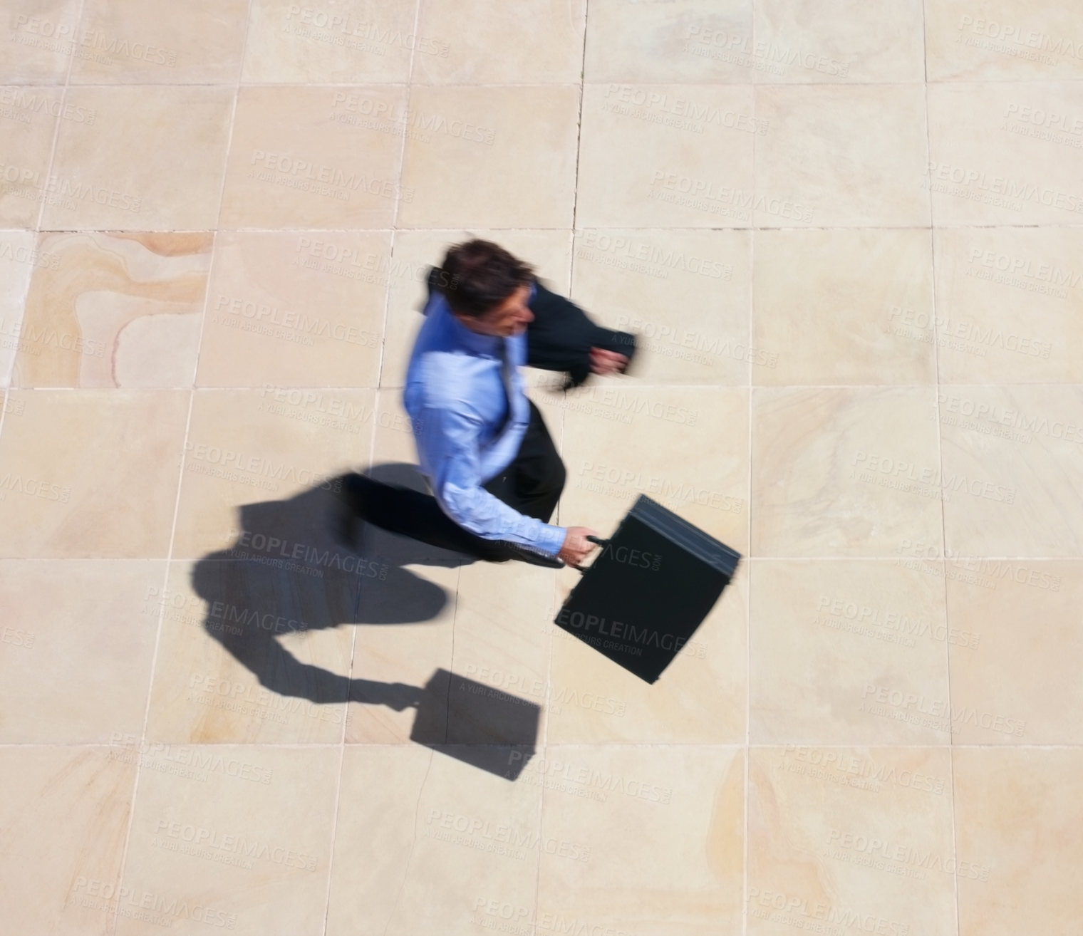 Buy stock photo Running, late and a business man rushing to work for an appointment with a briefcase from above. Panic, fast and delay with a professional employee in a hurry to get to his destination in the city