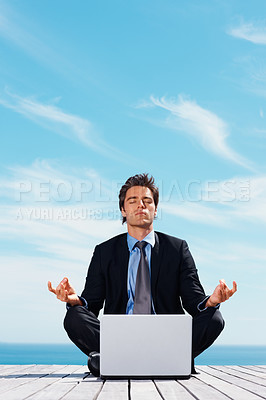 Buy stock photo Laptop, meditation and a corporate man outdoor on a dock by the ocean for mindfulness or stress relief. Computer, yoga and a young business employee on a pier by the sea for remote work or balance