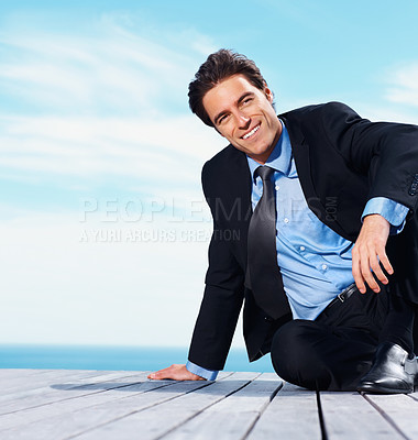 Buy stock photo Relax, thinking and sea with a business man on a pier against a blue sky background for company vision. Smile, idea and future with a happy corporate employee in a suit on a boardwalk by the ocean