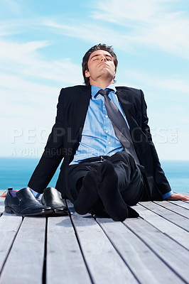 Buy stock photo Business man, vacation and relax outdoor on trip of a corporate professional on holiday with peace on deck. Worker, male employee and suit by sea with calm and blue sky with job and career by ocean