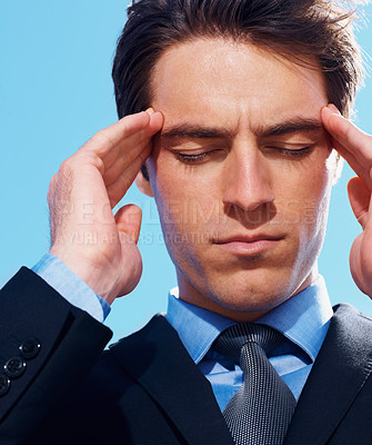 Buy stock photo Business man, headache and frustration or burnout, mental health and stress for debt. Professional, male person and migraine or anxiety, worry and massage temple for fatigue emergency by blue sky
