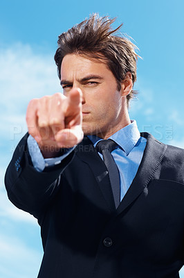Buy stock photo Business man, pointing and you with serious face outdoor for decision and choice for work. Corporate, male professional and recruitment for career and working with blue sky and we are hiring