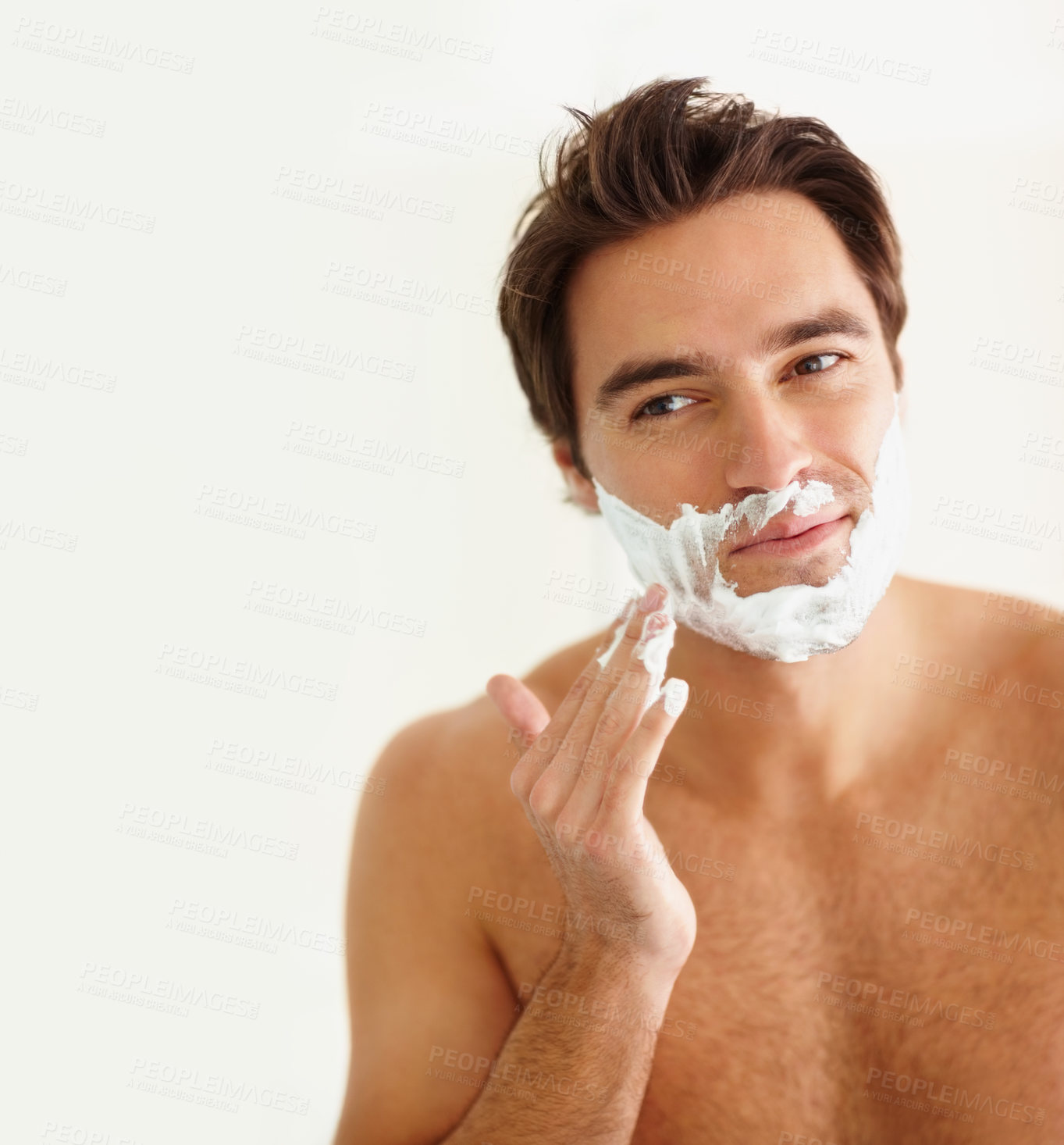 Buy stock photo Shaving, cream and face of happy man in morning, grooming routine and bathroom. Cosmetics, beauty and hand with hair removal, foam or person with self care in home for wellness of skin and body