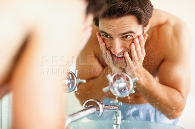 Buy stock photo Man, washing and face with water in bathroom for clean, hygiene or germs in morning. Happy person, hands and soap for skincare, routine or dermatology in smile in home with reflection, fresh or care