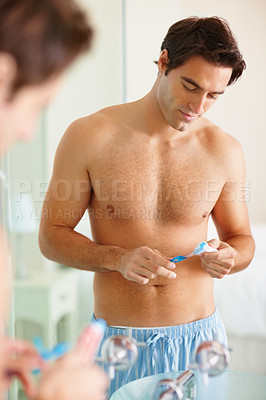 Buy stock photo Man, brush and toothpaste for oral health in bathroom or personal care, teeth or dental hygiene. Male person, get ready and product for wellness, cleanliness or grooming with morning routine in home