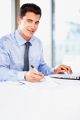 Buy stock photo Businessman, portrait and laptop or notes for financial paperwork or investment report, review or office desk. Male person, face and smile with economy growth or accounting, corporate or stock market