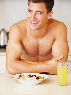 Buy stock photo Happy man, smile and fruit salad with juice in kitchen for delicious, nutrition or meal for breakfast. Male person, face and shirtless in excitement for fresh, organic or balanced diet for gut health