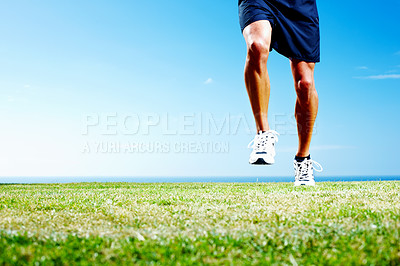 Buy stock photo Cropped image of a young man running against the sky - Copyspace
