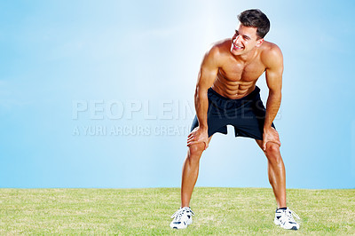 Buy stock photo Portrait of a tired young man resting after jogging against the sky - Copyspace
