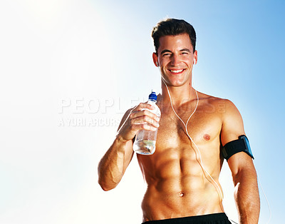 Buy stock photo Portrait of a handsome young guy standing with a water bottle against sky - Copyspace
