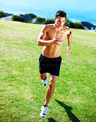 Buy stock photo Portrait of a young masculine man running on the green grass - Outdoor
