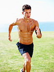 Muscular young man running against sky - Outdoor