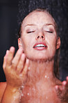 Pretty Caucasian woman having a bath under a shower