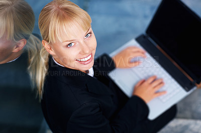 Buy stock photo Portrait of happy woman on stairs in office with laptop, smile or relax in lobby for market research on web. Face of businesswoman on steps typing email, report or online business schedule from above