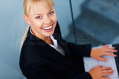 Buy stock photo Portrait of woman on stairs in office with laptop, smile or relax in lobby for market research on web. Happy face of businesswoman on steps typing email, report or online business schedule from above
