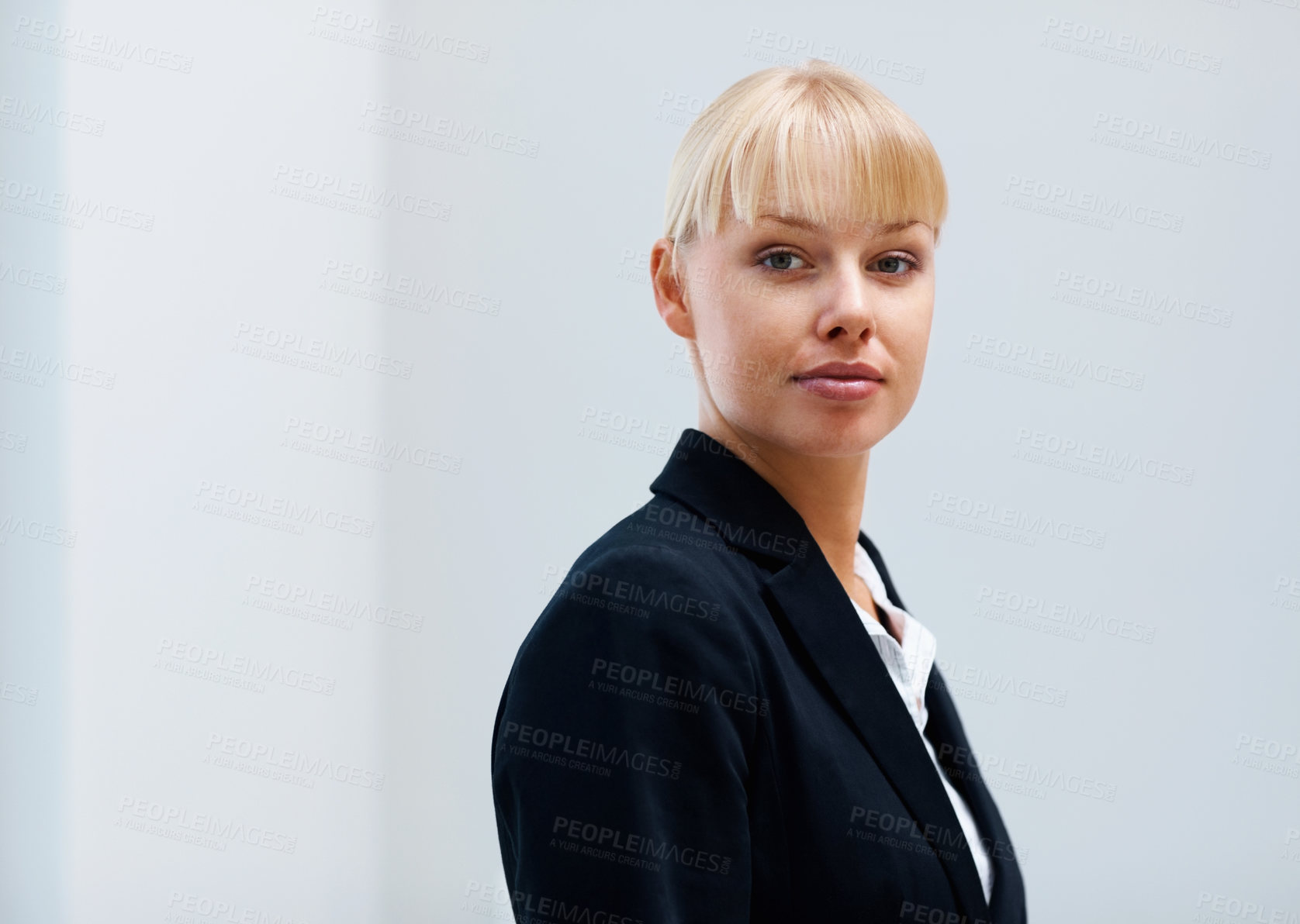 Buy stock photo Portrait, confidence and business woman in office, workplace or corporate company on mockup space in Switzerland. Serious face, professional female agent and entrepreneur, worker and employee in suit