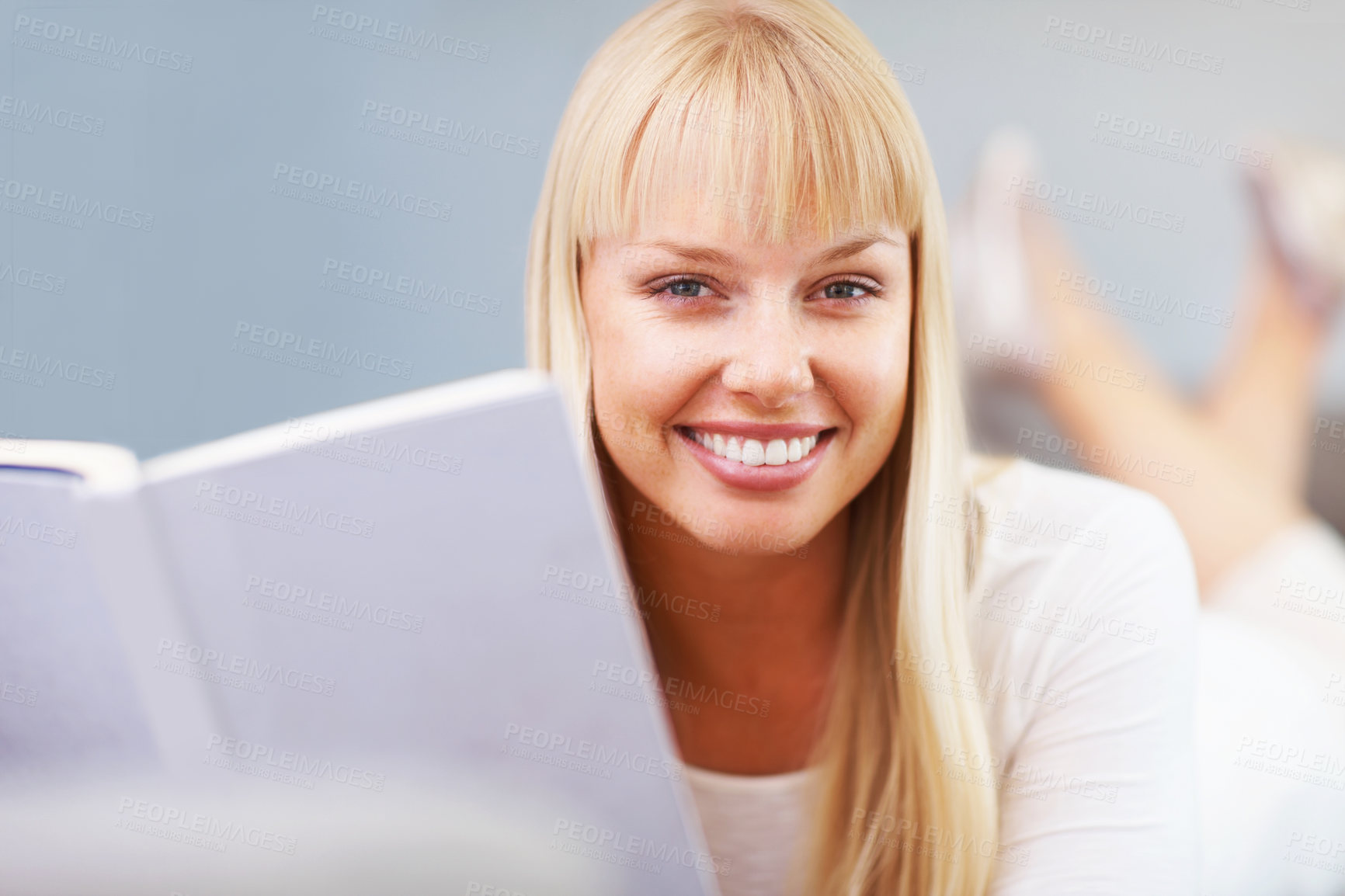 Buy stock photo Closeup of attractive young woman with a book and smiling